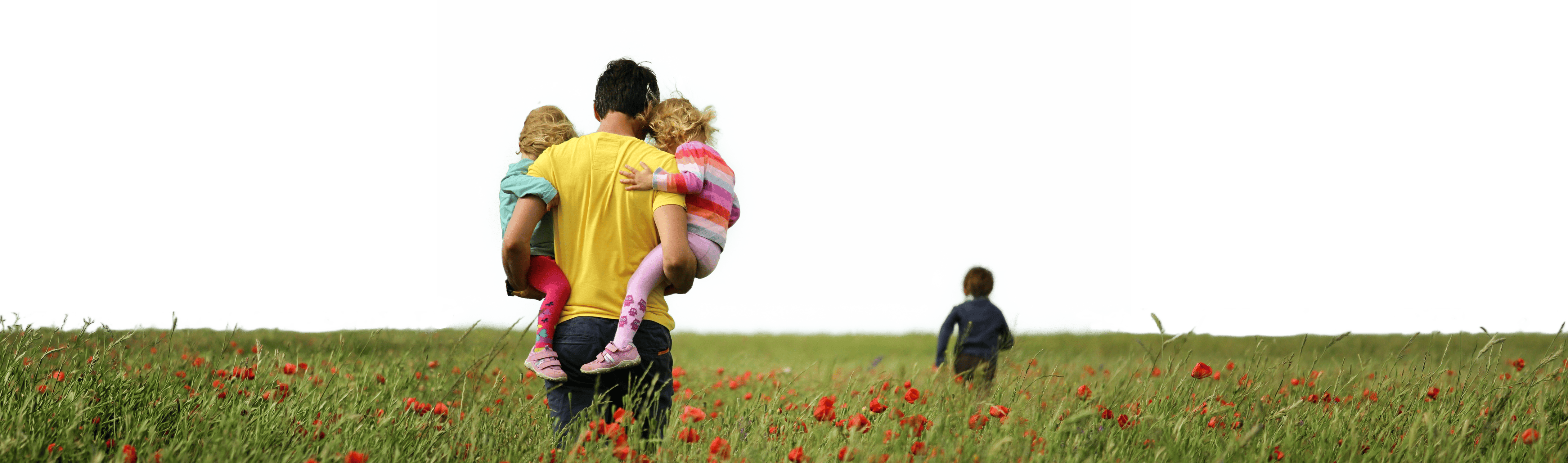 Family walking together on a sunlit park path, illustrating EZPZ's human approach to insurance.